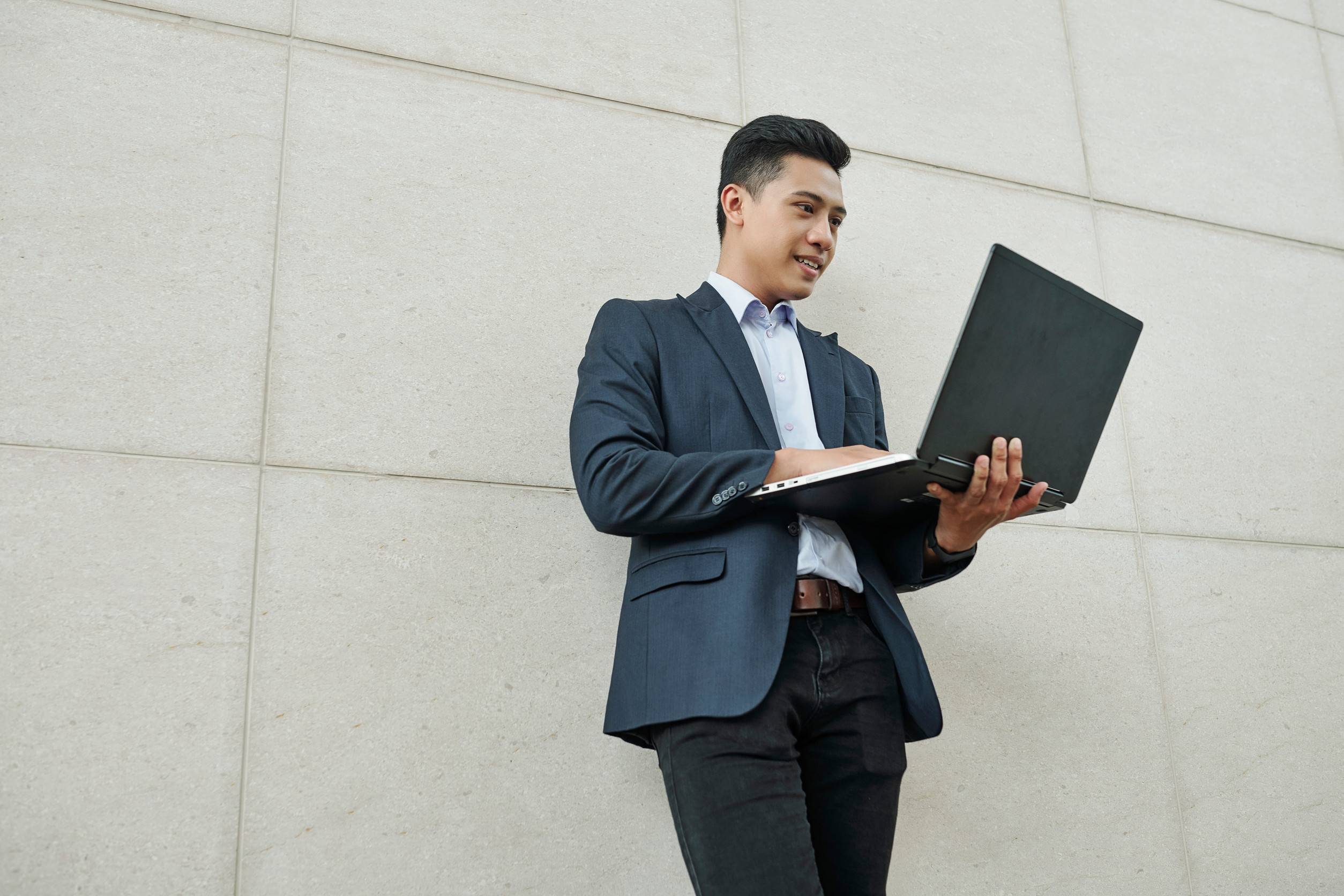 Businessman Holding A Laptop