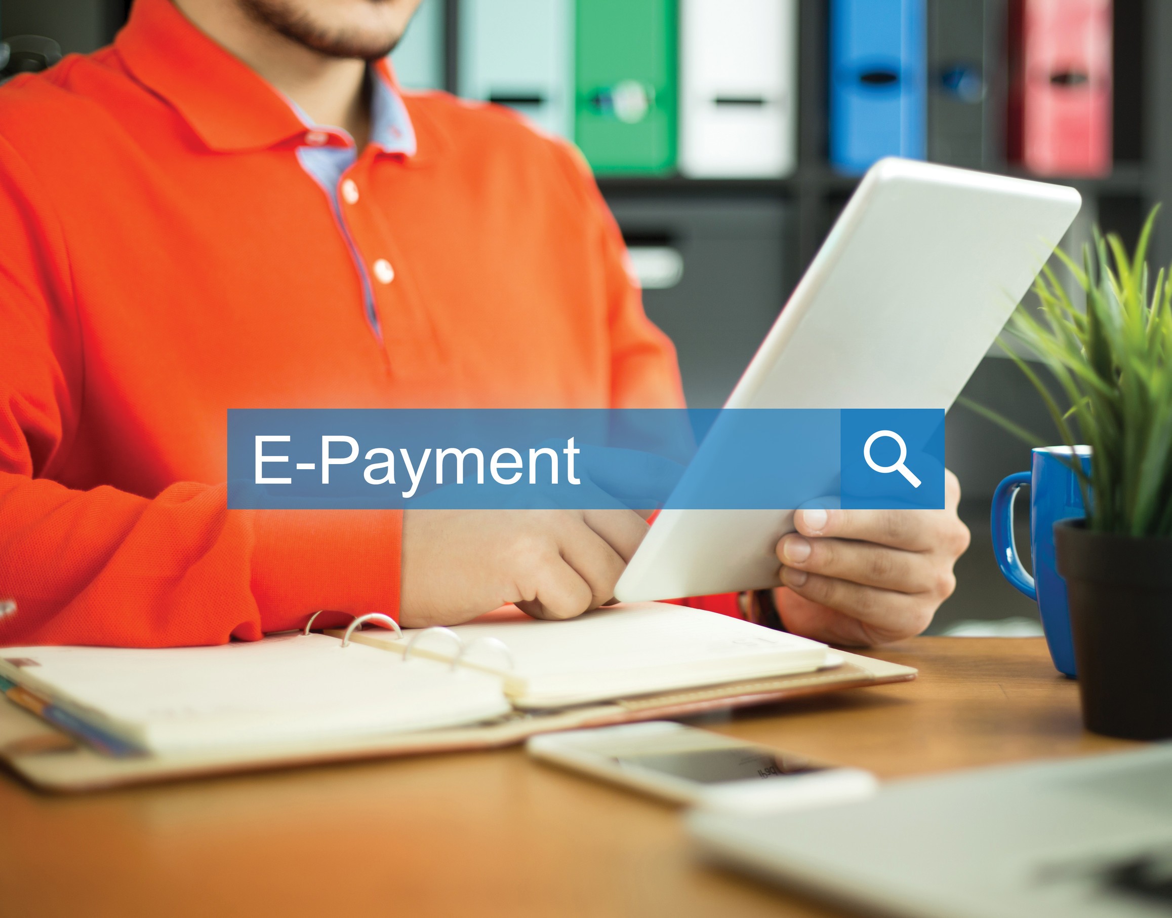 Young Man Working In An Office With Tablet Pc And Searching E Payment Word On Internet
